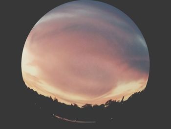 Close-up of silhouette against sky at sunset