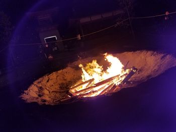 High angle view of illuminated bonfire at night