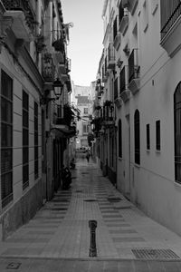 Alley amidst buildings in city