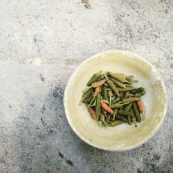 High angle view of black peppercorn in bowl on floor