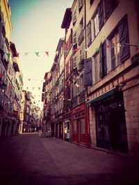 Street in city against sky