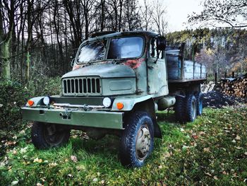 Abandoned car on field