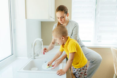 Mother and daughter in bathroom