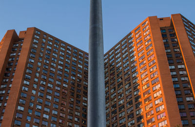 Low angle view of skyscraper against clear sky