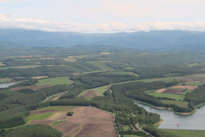 Aerial view of agricultural landscape against sky