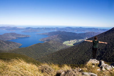 Scenic view of mountains against clear blue sky