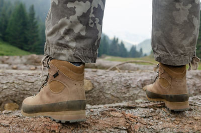 Low section of man standing on ground