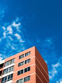 Low angle view of building against blue sky