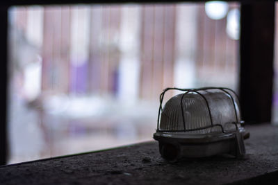 Close-up of empty table against window