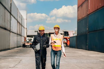 Portrait of people standing on road