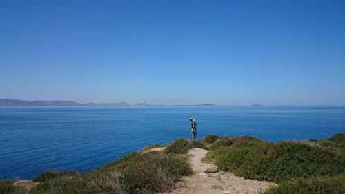 Scenic view of sea against clear blue sky