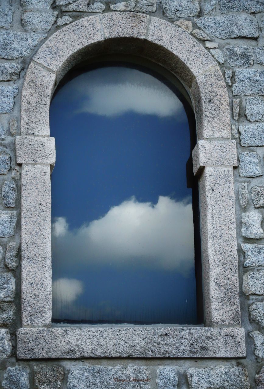 ARCH WINDOW ON WALL OF BUILDING