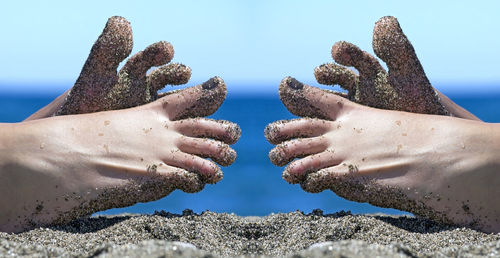 Sandy woman toes relaxing on the beach , blue sea background, to remember holidays in seascape image