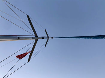 Low angle view of crane against blue sky