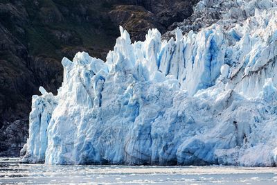 Scenic view of sea from snowcapped landscape