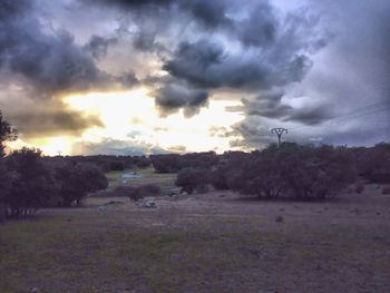 Scenic view of landscape against cloudy sky