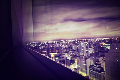 Cityscape against cloudy sky