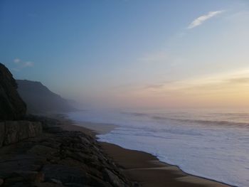 Scenic view of sea against sky during sunset