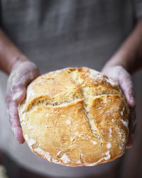 Close-up of hand holding bread