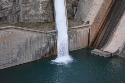 High angle view of dam against wall
