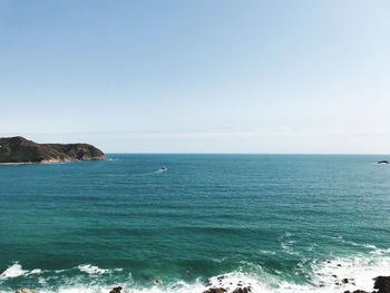 Scenic view of sea against clear sky