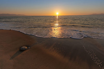 Scenic view of sea against sky during sunset