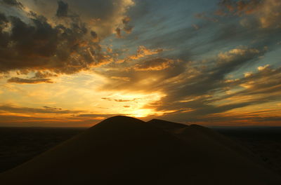 Scenic view of dramatic sky during sunset