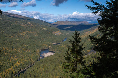 Scenic view of landscape and mountains against sky