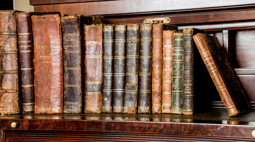 Close-up of old books in shelf