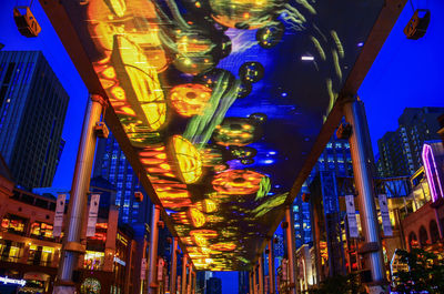 Low angle view of illuminated buildings at night