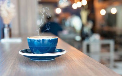 Close-up of coffee cup on table in cafe