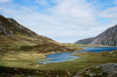 Scenic view of lake and mountains against sky