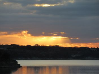 Scenic view of lake against sky during sunset