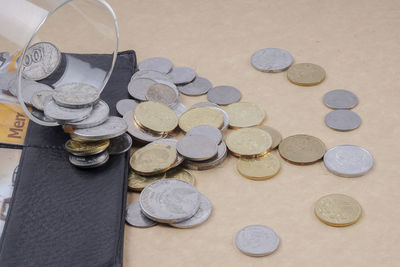 High angle view of coins on table