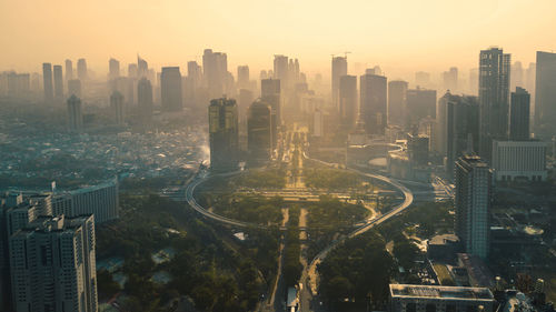 High angle view of buildings in city against sky