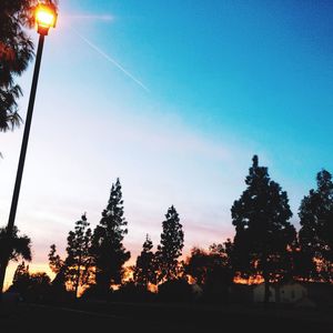 Low angle view of street light against sky at night