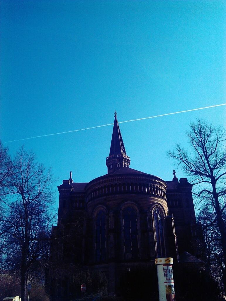 architecture, built structure, building exterior, low angle view, bare tree, tree, clear sky, blue, sky, church, religion, place of worship, copy space, dusk, outdoors, silhouette, no people, facade, spirituality