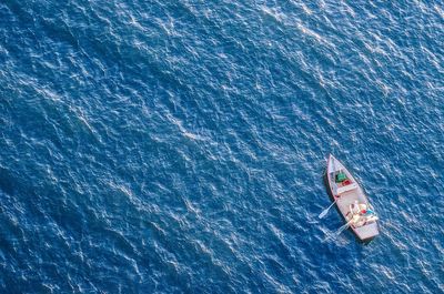 High angle view of sailboat sailing in sea