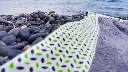 Close-up of pebbles on beach