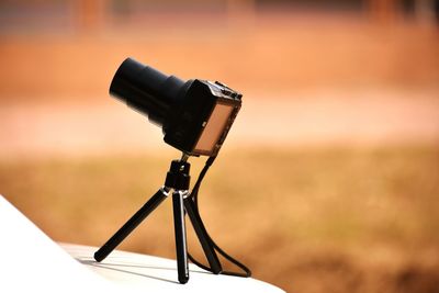 Close-up of camera on table