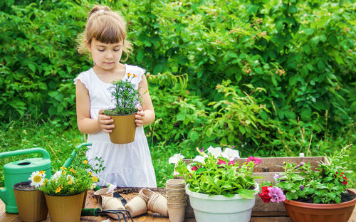 High angle view of boy gardening in yard