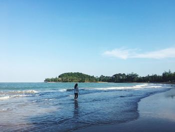 Man on beach against sky