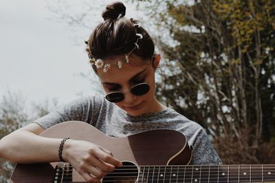 Young woman playing guitar