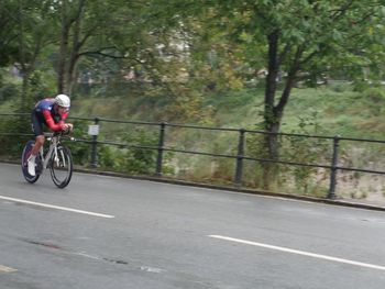 Man riding bicycle on road