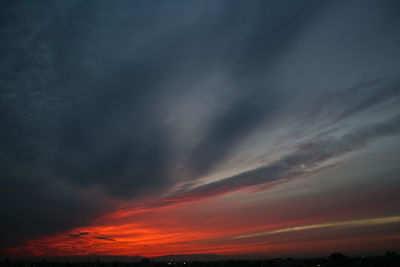 Low angle view of dramatic sky during sunset