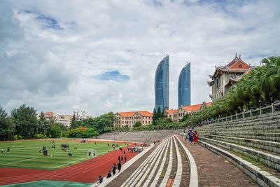 City skyline against cloudy sky
