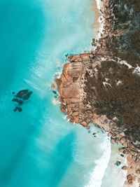 Close-up of swimming pool by sea against sky