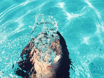 High angle view of woman swimming in pool