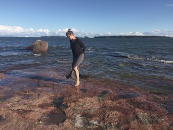 Full length of man on beach against sky