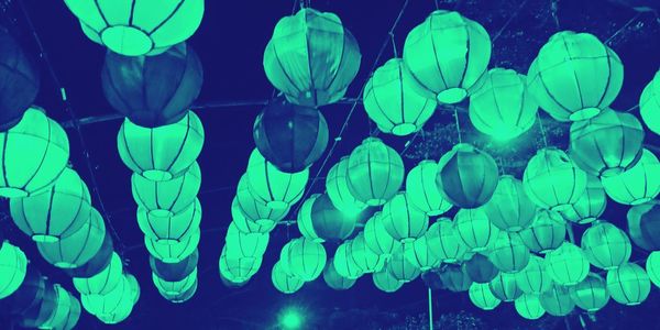 Low angle view of illuminated lanterns hanging at night